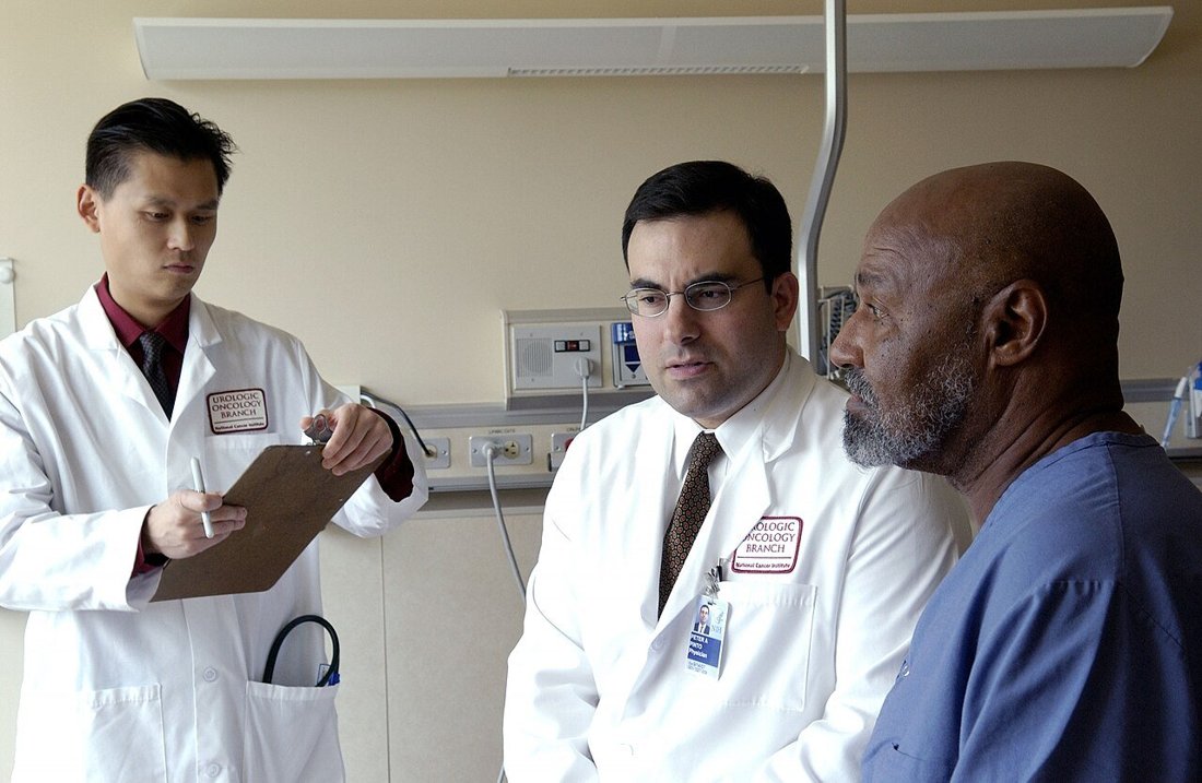 Doctors consulting with a patient